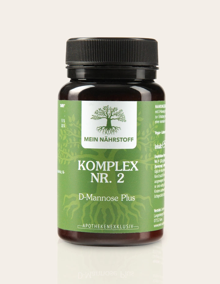 Braunes Nahrungsergänzungsmittel-Glas mit grünem Etikett, Aufschrift ‚MEIN NÄHRSTOFF – KOMPLEX NR. 2 – D-Mannose Plus – Apothekenexklusiv‘, mit Baum-Logo und schwarzem Schraubdeckel.